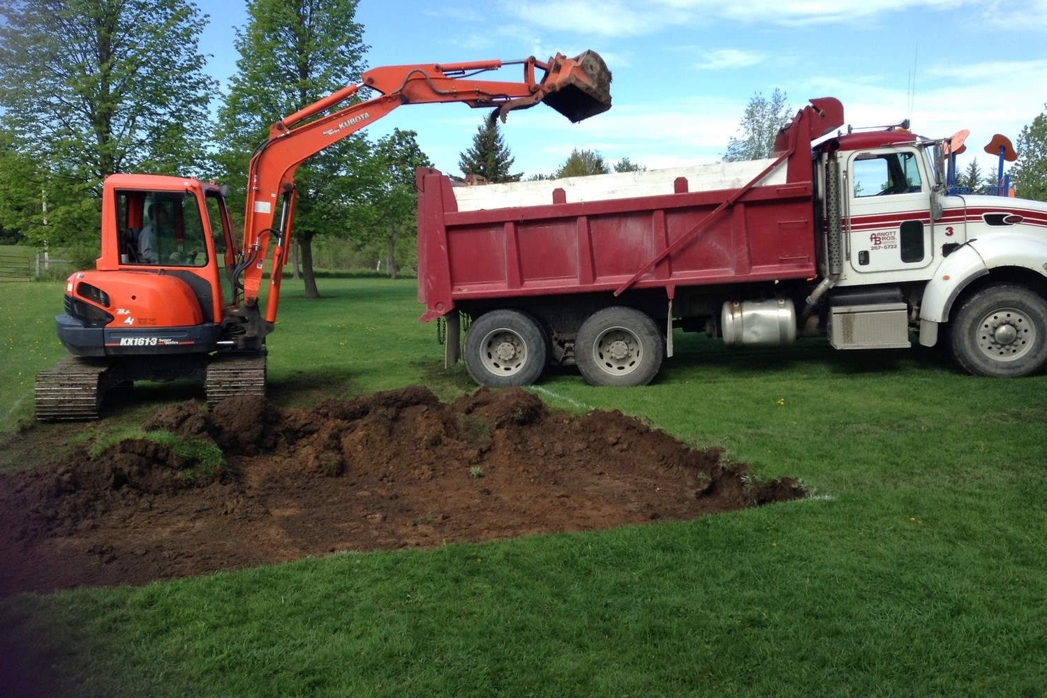Image of a bulldozer and truck 